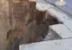 FOTO: ATENȚIE, PERICOL PUBLIC! Prăpastie pe Drumul Naţional 11 A care trece prin Podu Turcului spre Adjud şi Bârlad. Asfaltarea celor 37 de kilometri a început acum șapte luni